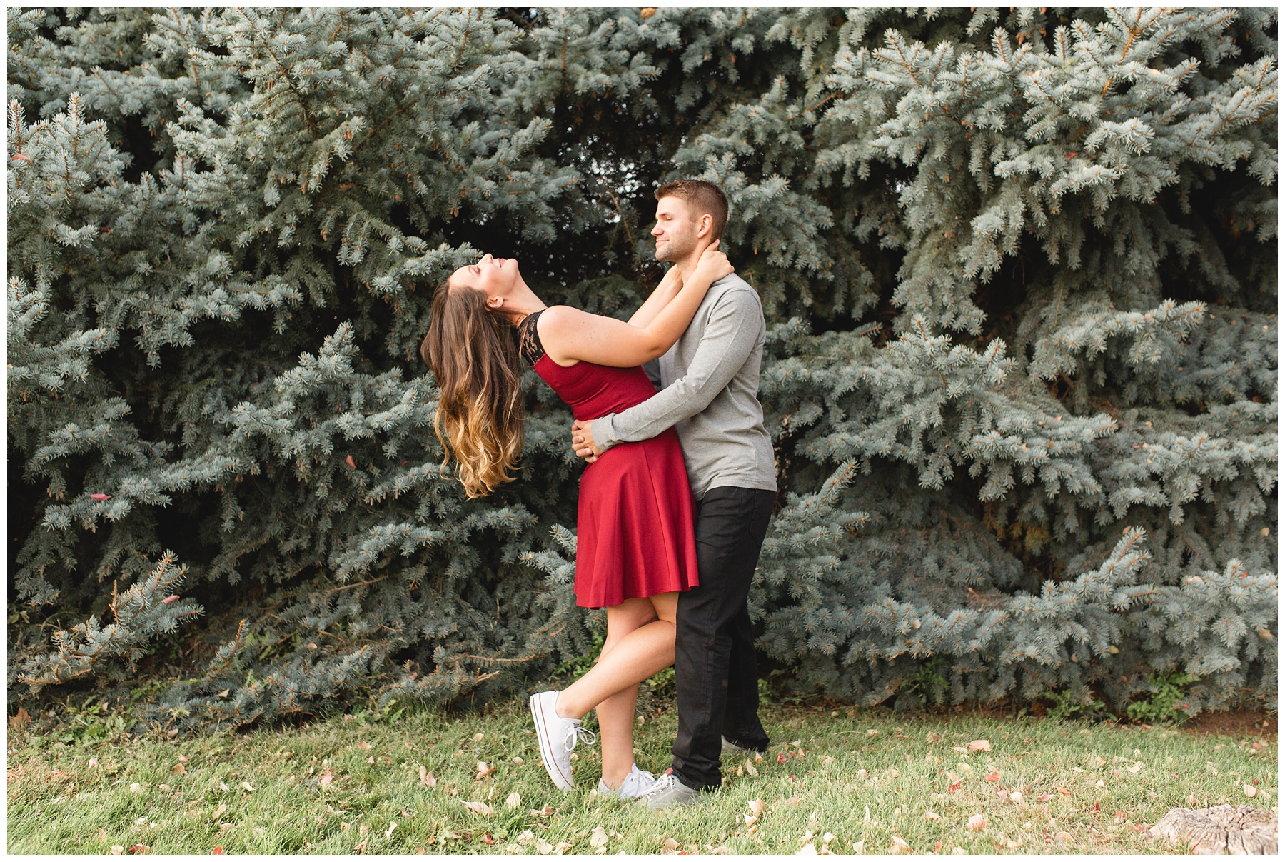 Natural light couples session couple dancing in front of pine tree