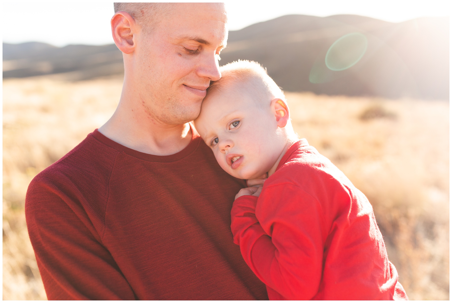Son and father in the sunlight with natural skin tones Photo by Miranda Renee