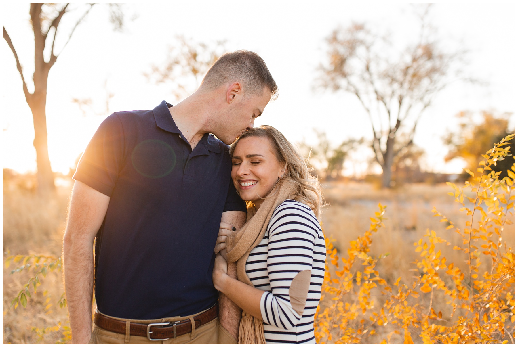 Natural light photographer in Boise Idaho, couple kissing forehead in the sunset