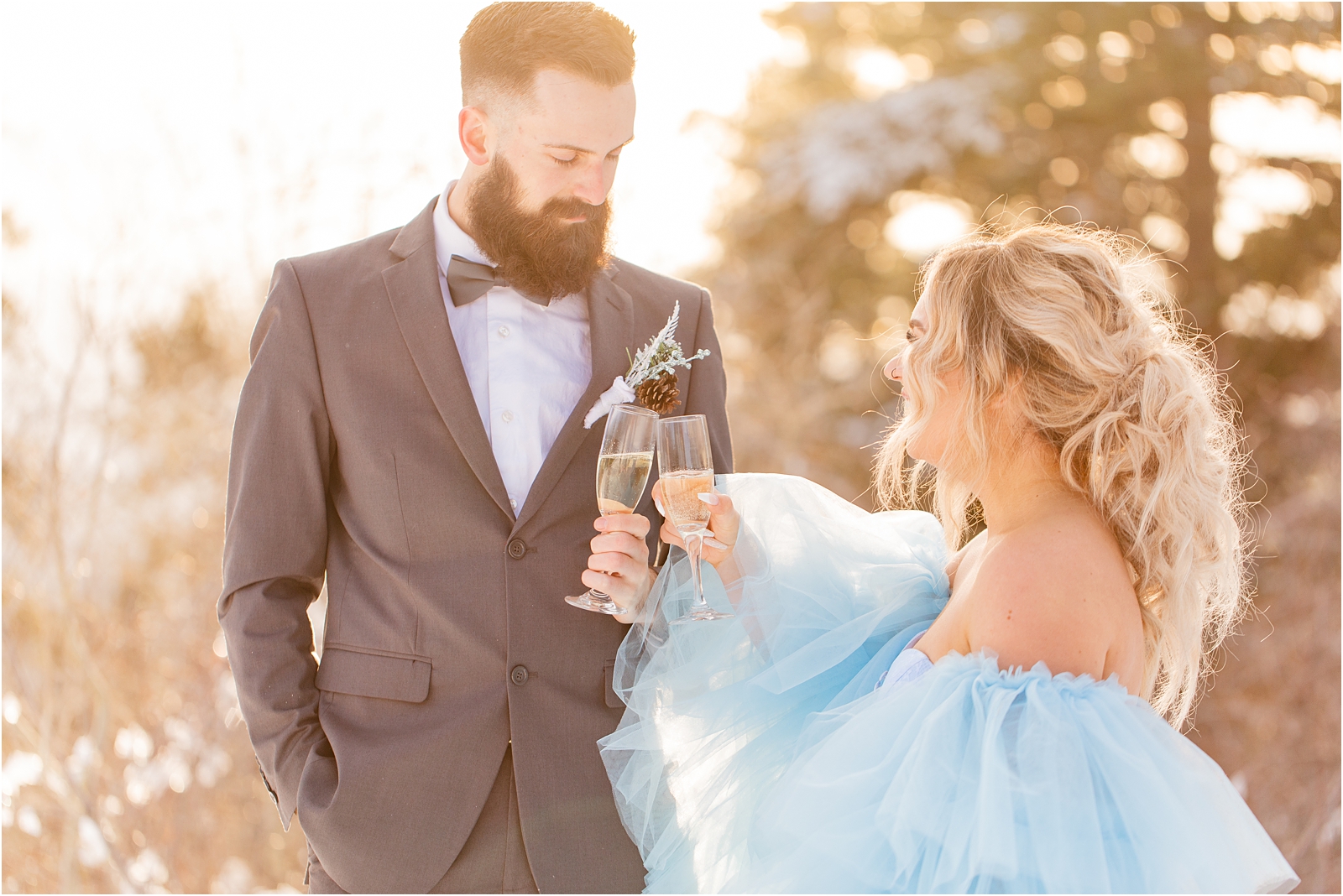 Bride and groom toasting to their Winter Wedding in Idaho