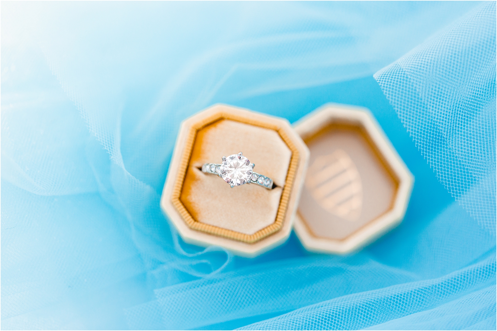 Winter Wedding in Idaho wedding ring in Mrs. Box velvet ring box on her blue chiffon wedding dress
