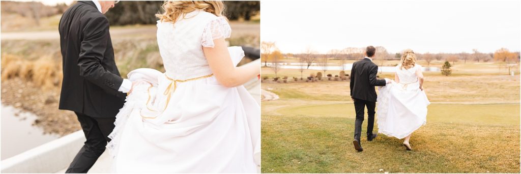 groom holding bride's dress as they walk away on a golf course