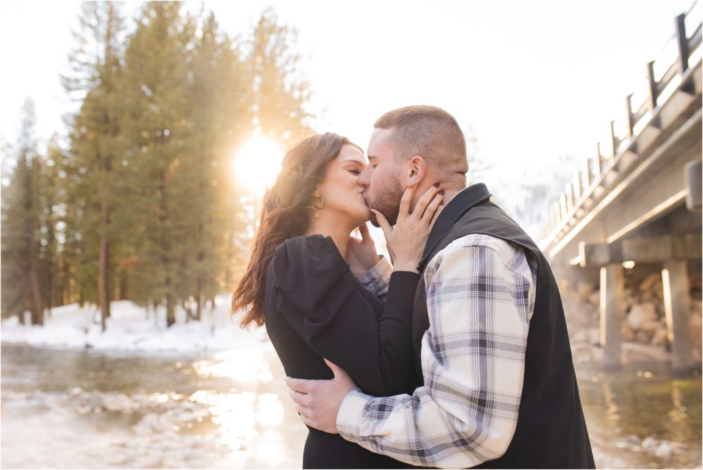Couple kissing at bridge hot springs Boise engagement photos