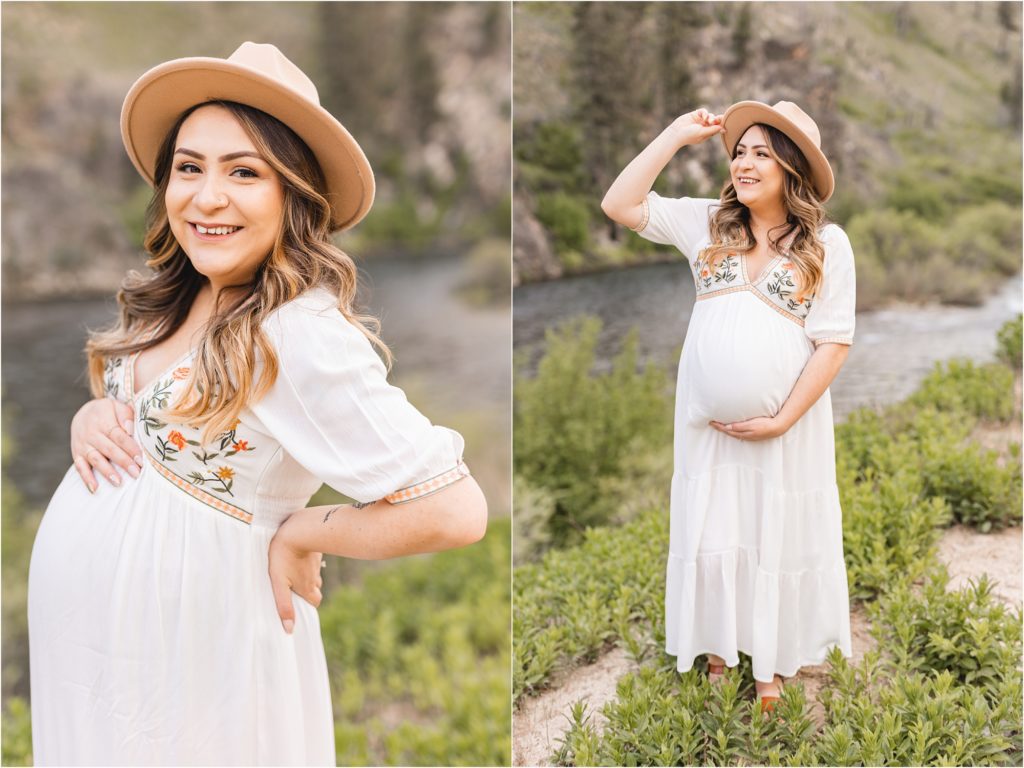 Pregnant mom in white maternity dress and flat brim hat by the river in boho-inspired photos