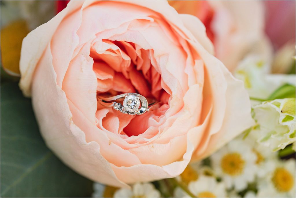 Wedding ring in peach colored cabbage rose