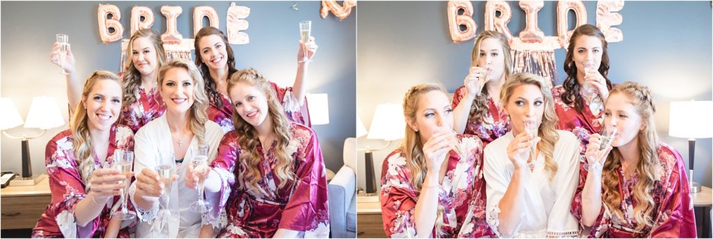 bride and bridesmaids in matching robes drinking mimosas
