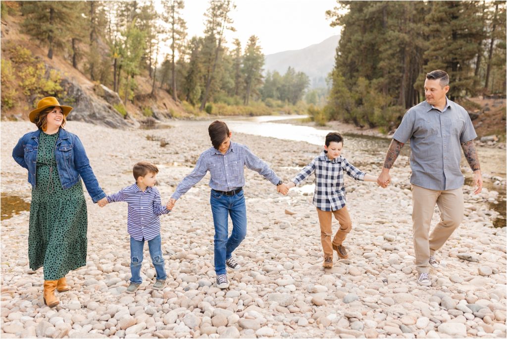 family of 3 boys walking toward the camera holding hands photo by Miranda Renee Photography