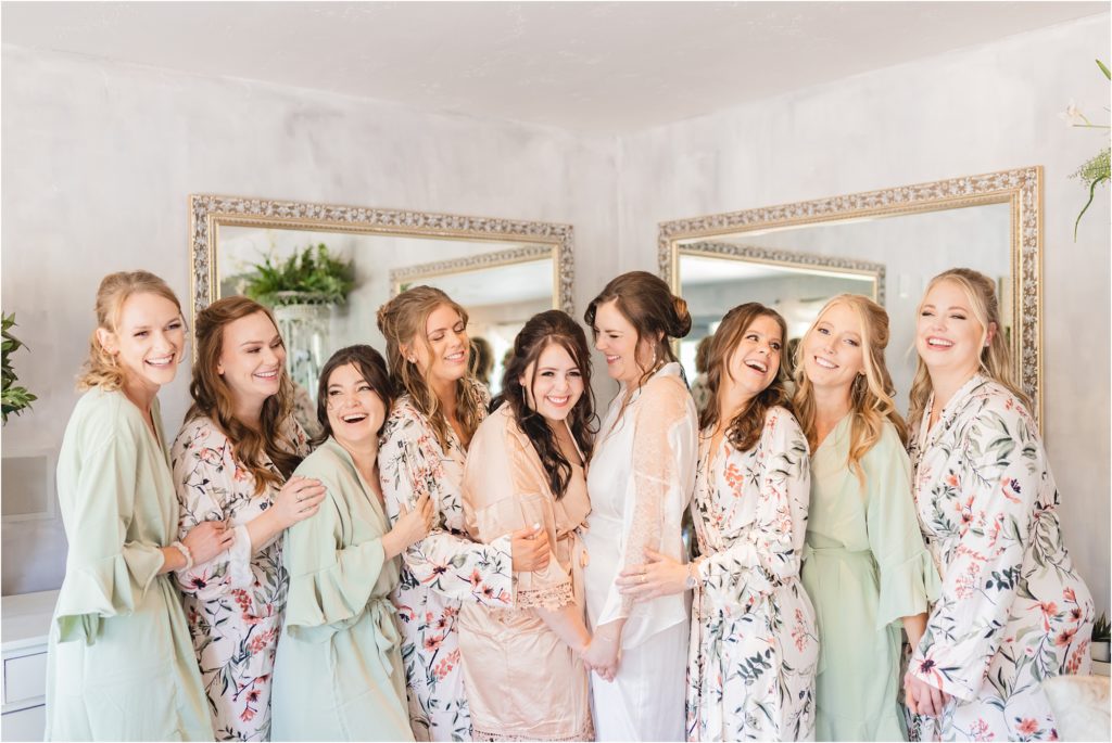 bride and bridesmaids in matching robes getting ready in Meridian Idaho