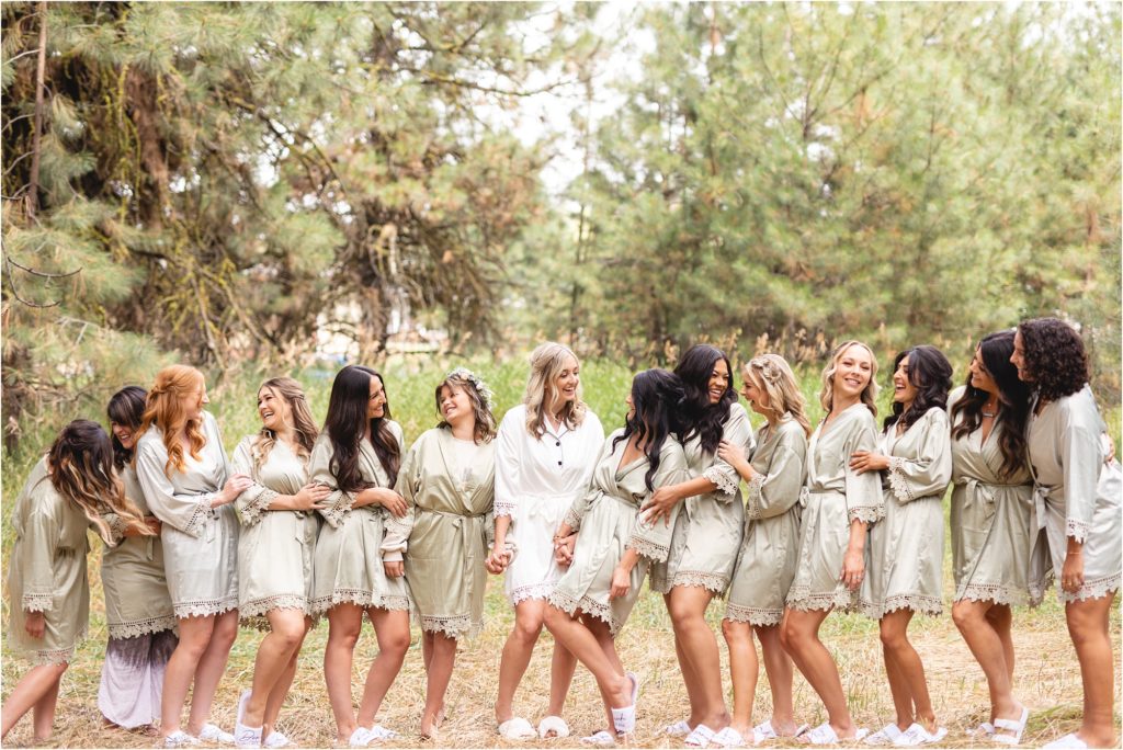 bride and bridesmaids in matching robes at Riverside pines