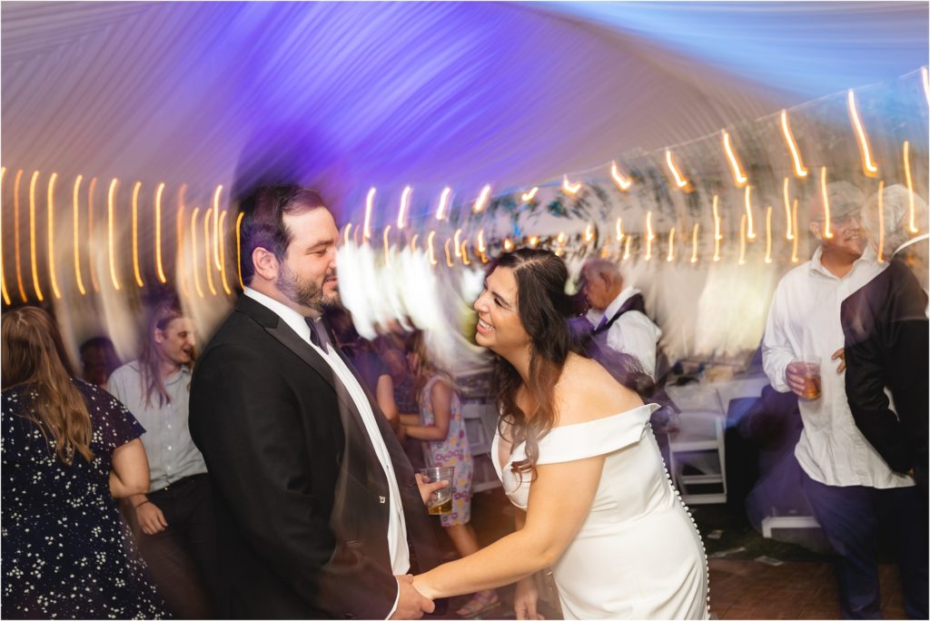 bride and groom at wedding reception dancing