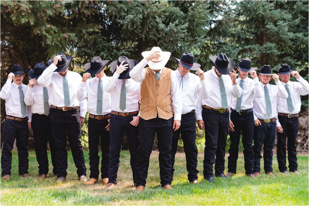 Wedding at Riverside Pines, groom and groomsmen with cowboy hats