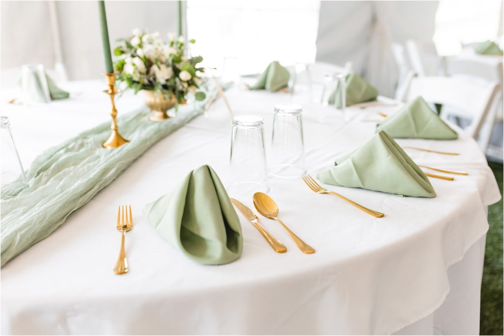 ivory table with green sage napkins