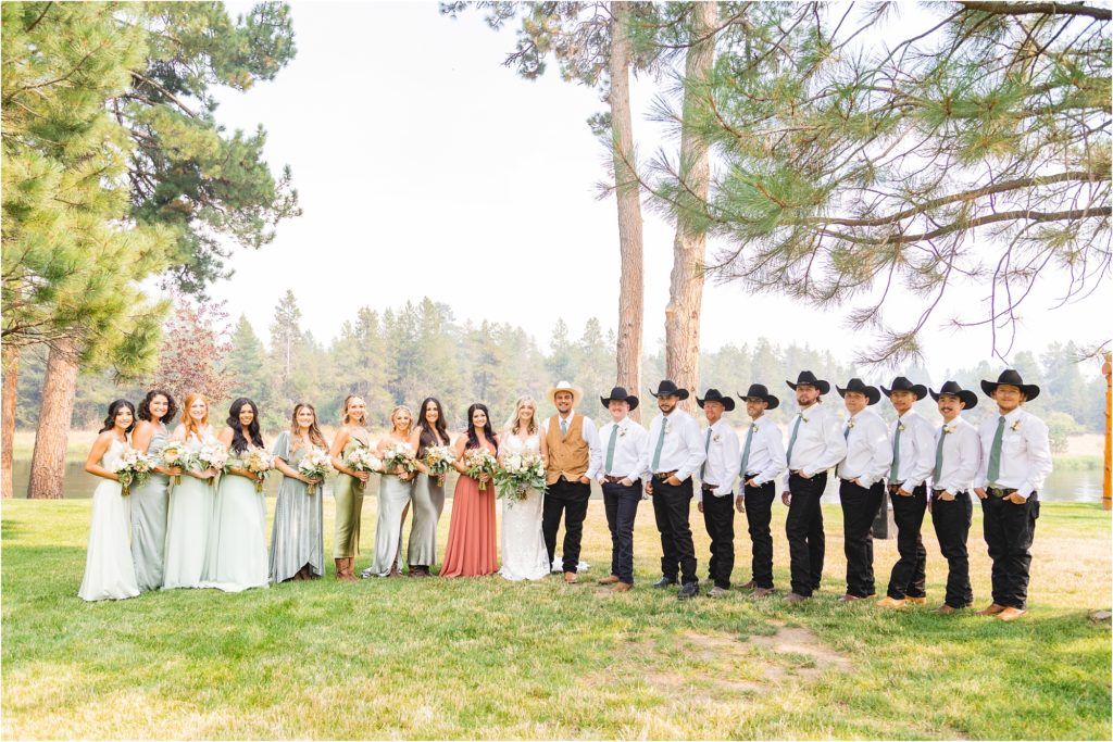large wedding party dressed in sage, ivory, and rose. boise idaho