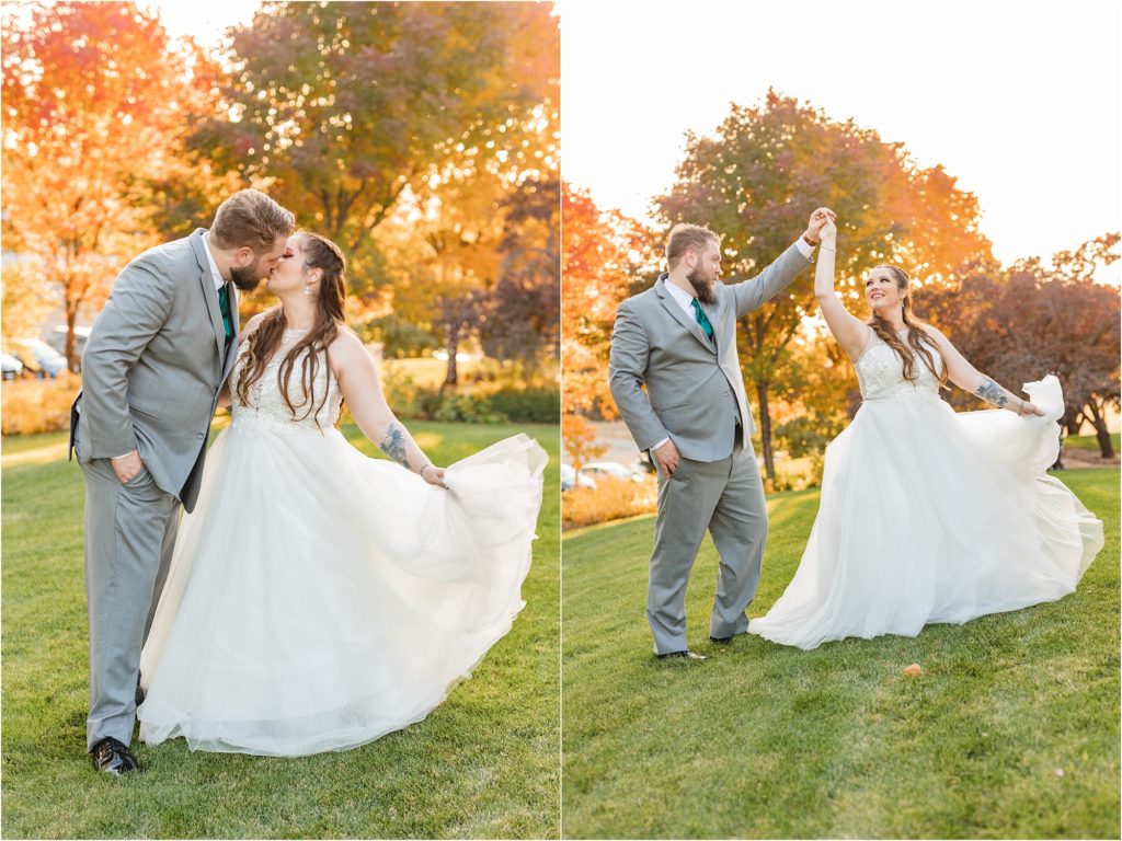 groom twirling bride with fall trees in background photos by miranda renee photography