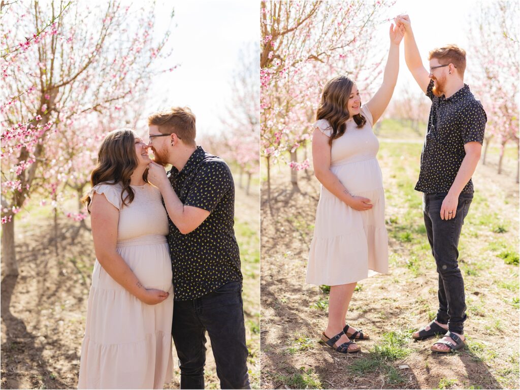 pregnant couple in a blooming orchard in Idaho