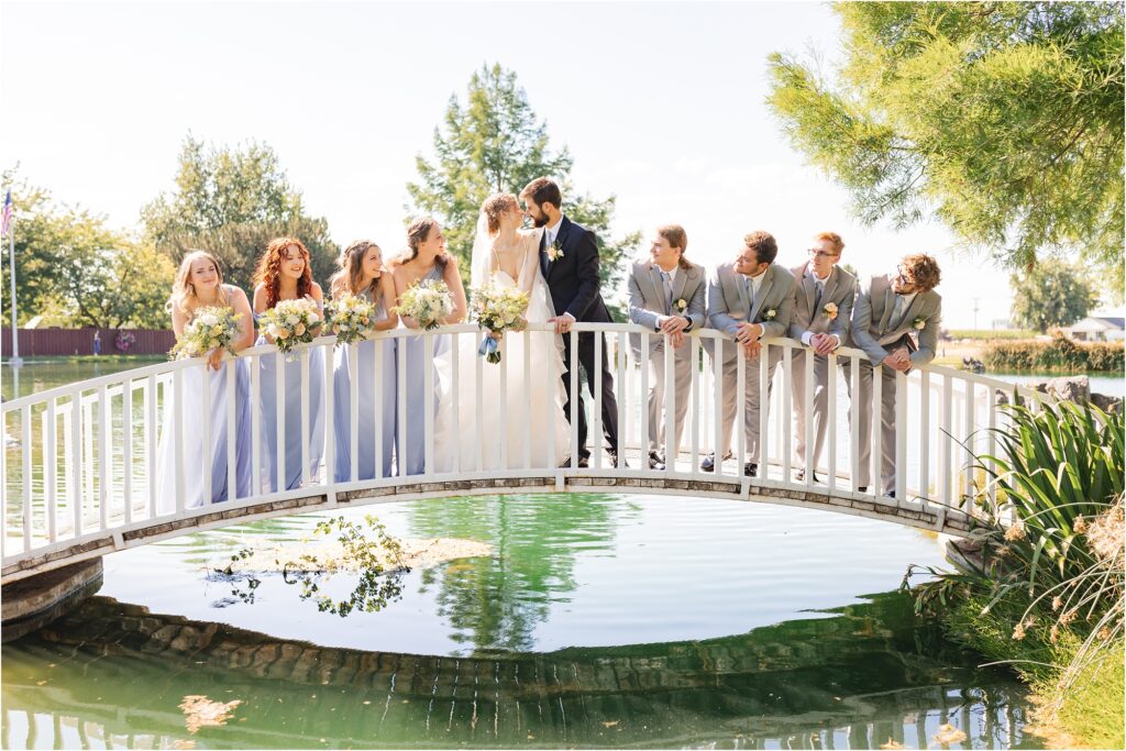 wedding party on pond bridge at still water hollow
