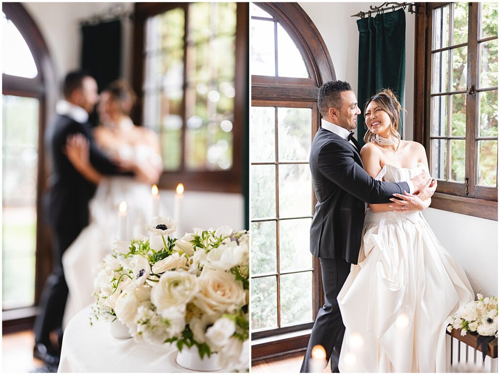 grom dressed in black holding bride from behind