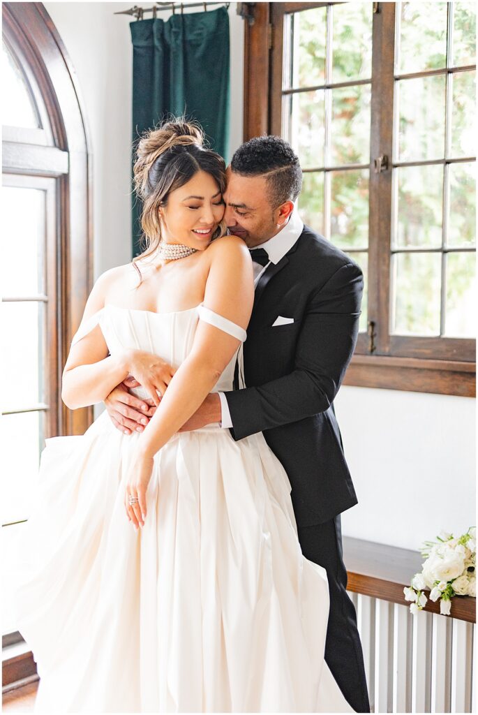 bride and groom snuggled up together, photo by miranda renee photography