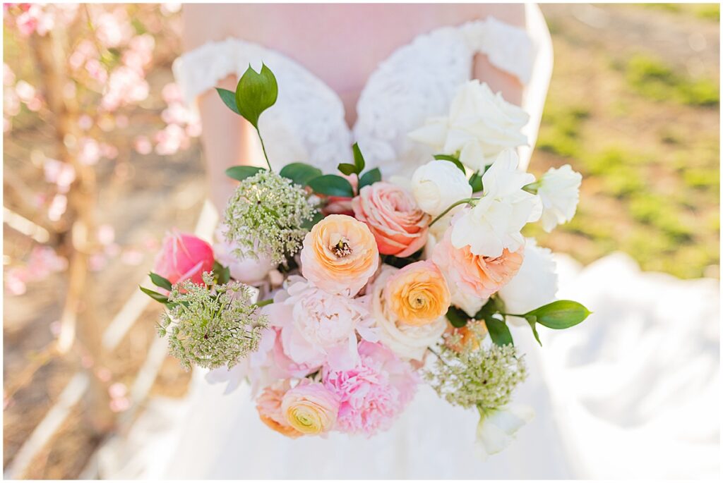 bride holding bouquet from lae event floral