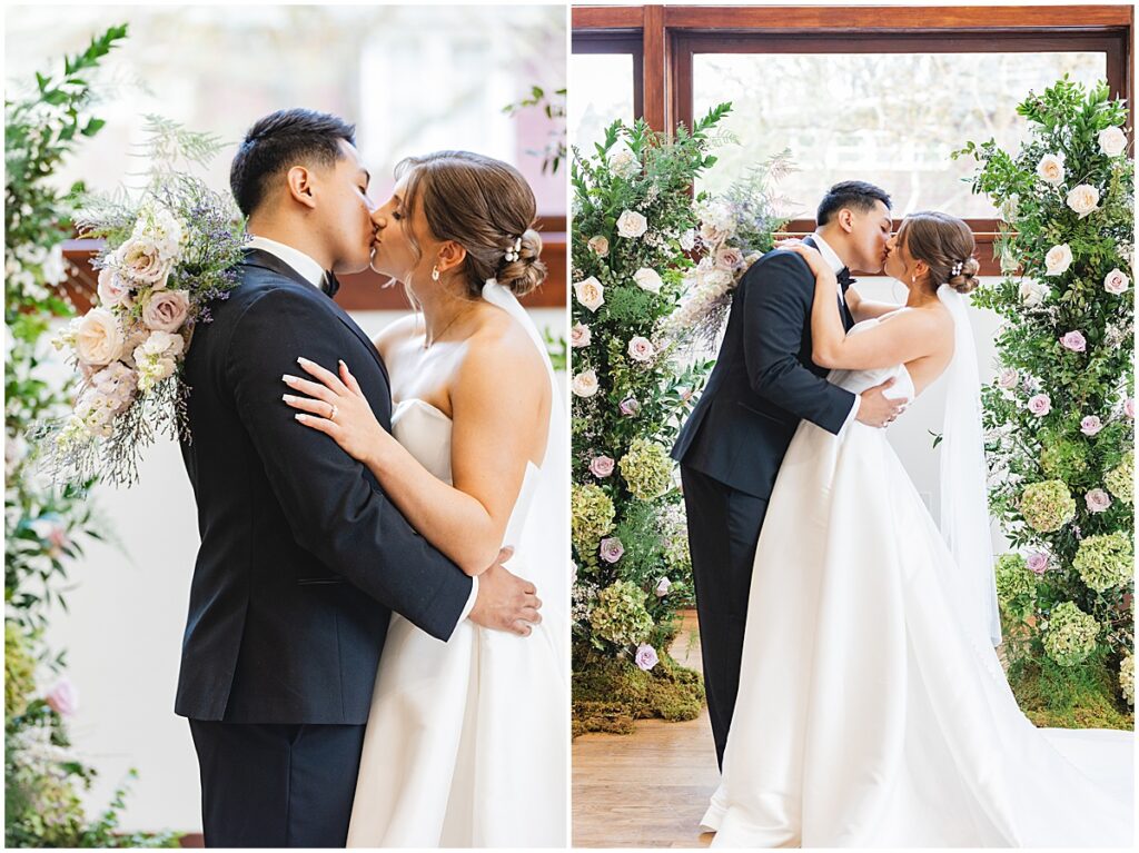 Bride and groom kissing in front of broken floral arch Whimsical Spring Wedding at The TRICA