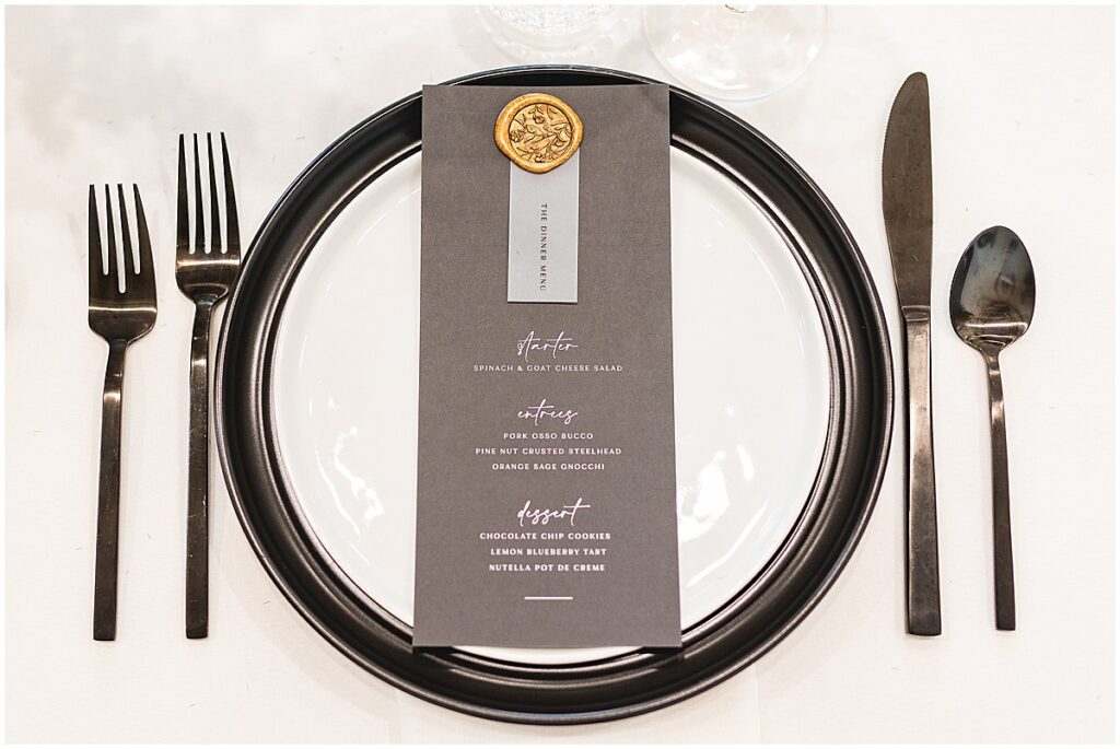 Black and white place setting for wedding reception table Whimsical Spring Wedding at The TRICA