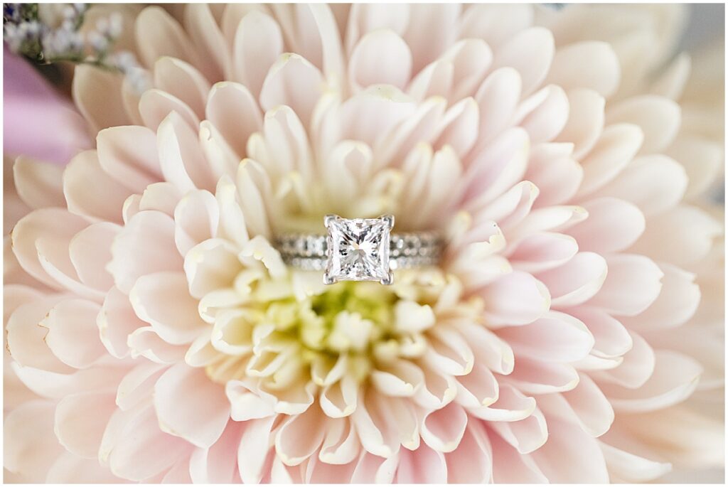 Princess cut wedding ring in a pink flower