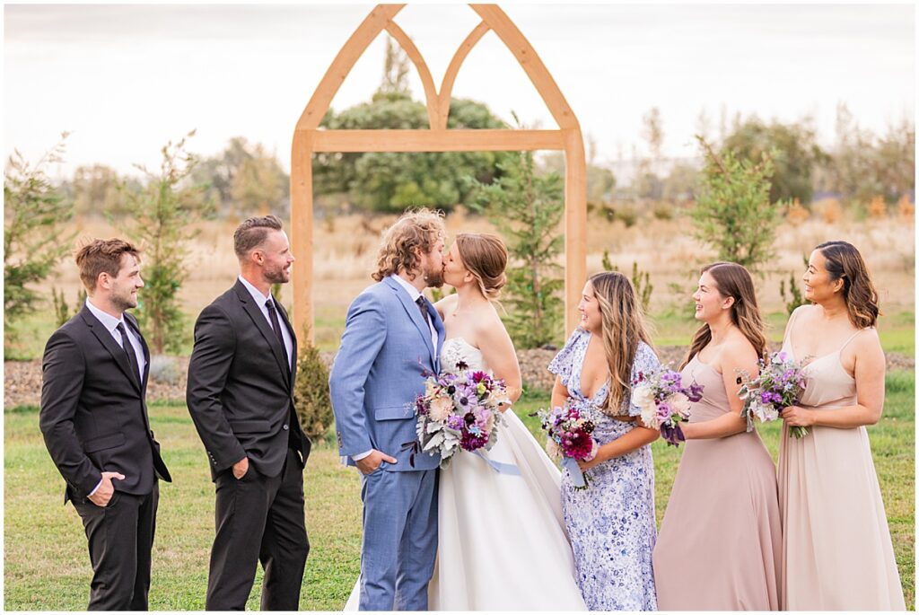 wedding party in beige, blue, and black