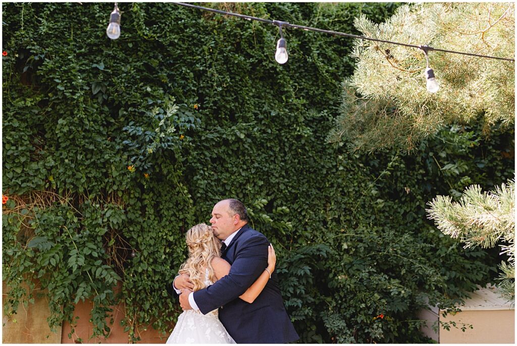 bride and her dad hugging at fox canyon vineyard