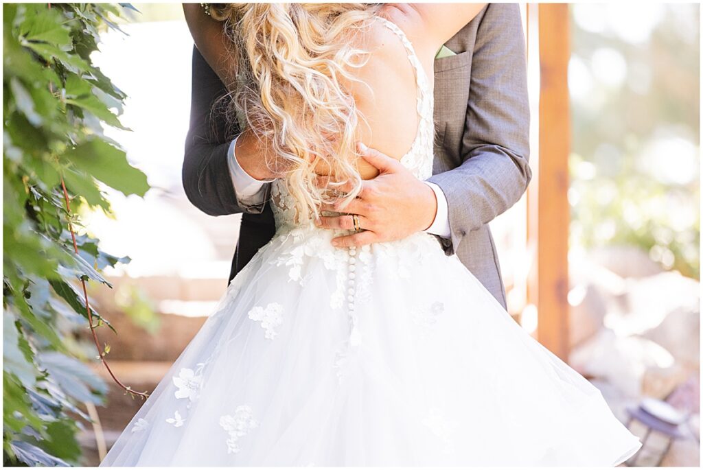 groom holding bride's back