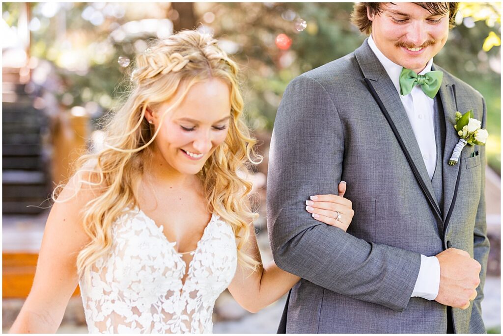 bride and groom walking arm in arm