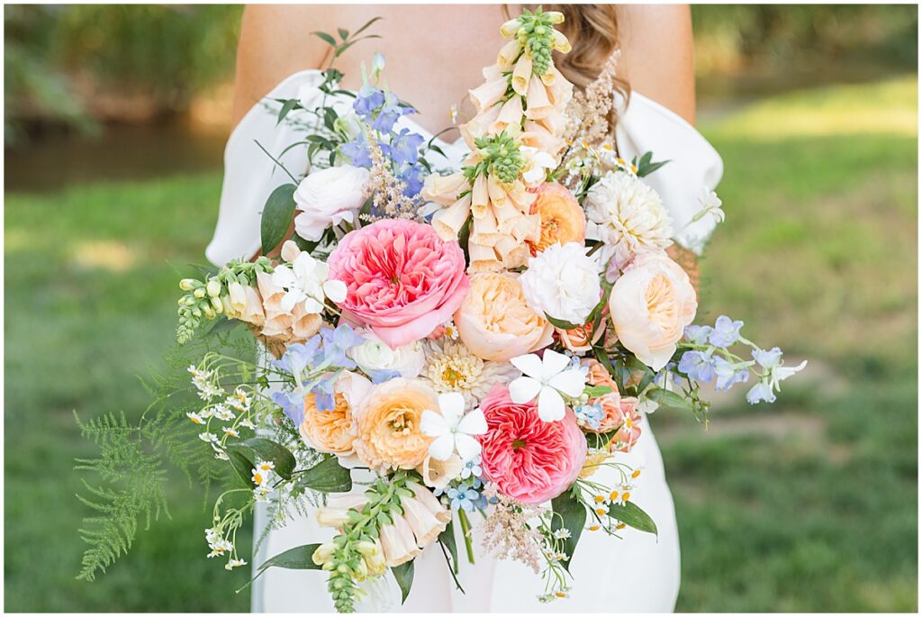 bride holding summer floral bouquet