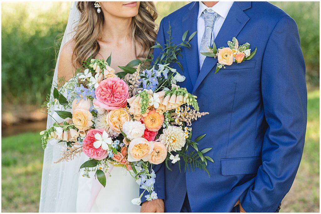 groom in blue suit and bride in white dress