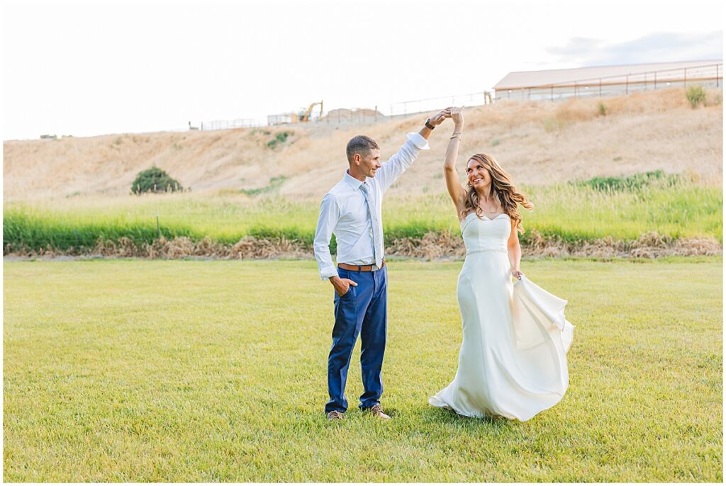 groom twirling bride