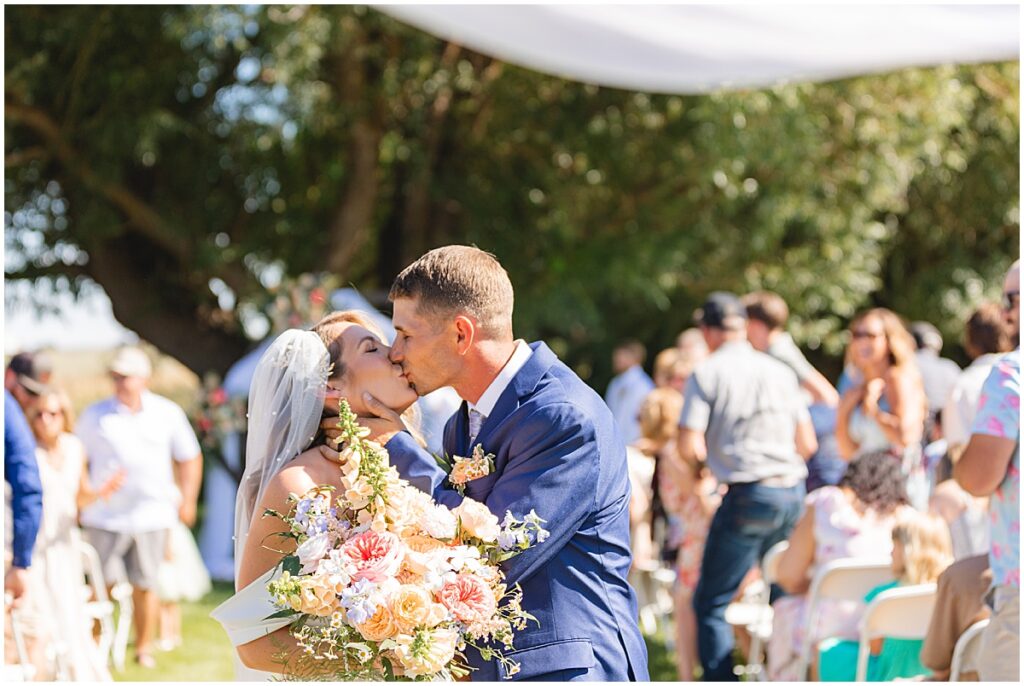 kiss at the end of the aisle